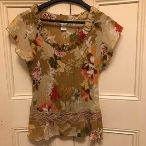 Woman’s beautiful fall floral blouse.